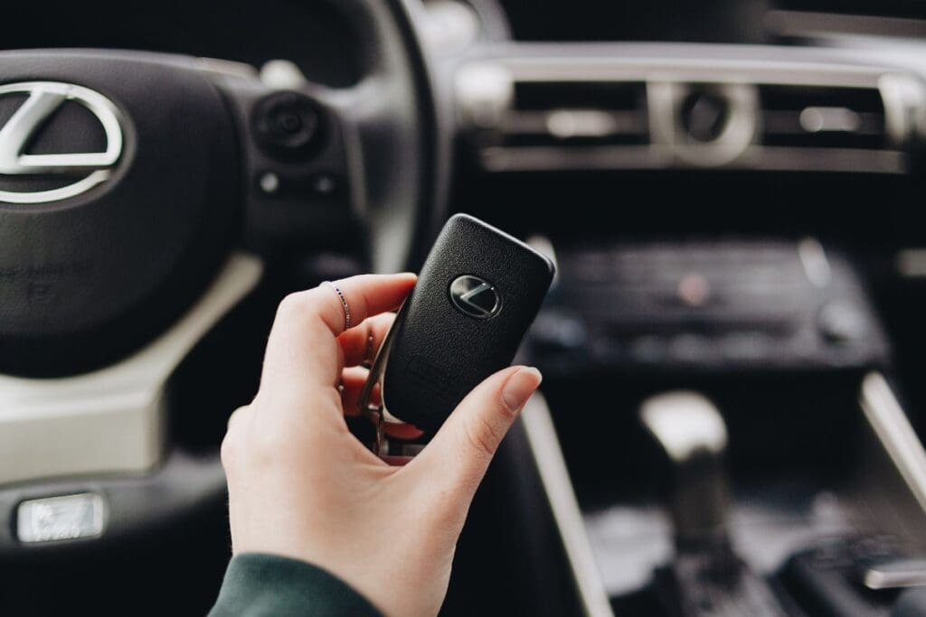 Driver is checking her car remote key