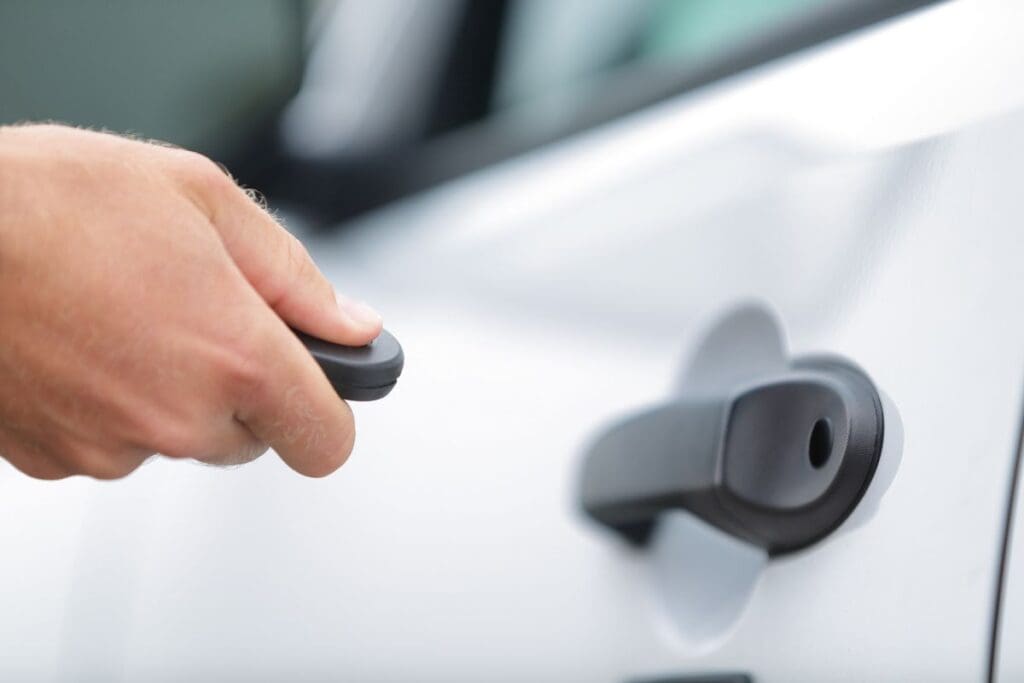 Car owner is operating the car remote key