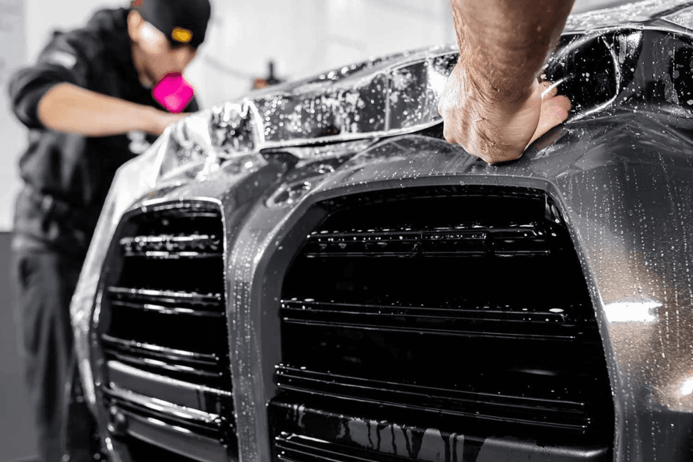 Micorp auto restyler crew is carefully installing PPF on car bumper