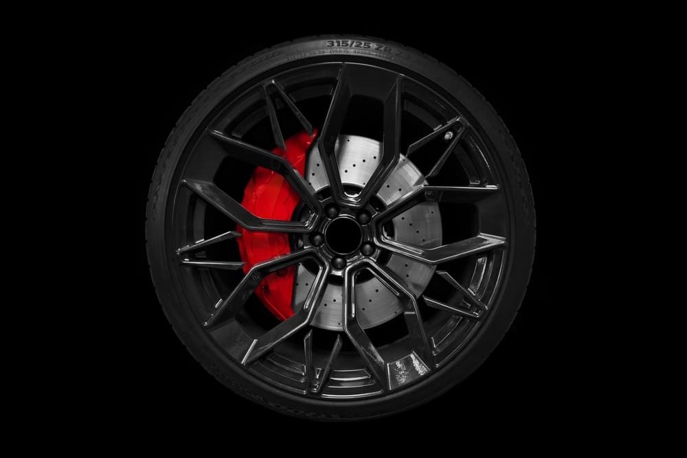 Car,Alloy,Wheel,And,Tyre,Isolated,On,Black,Background.,New